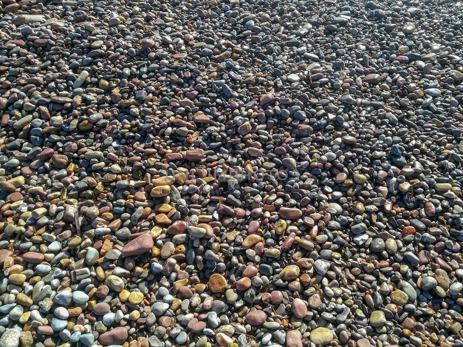 Rounded stones on the beach of different colors