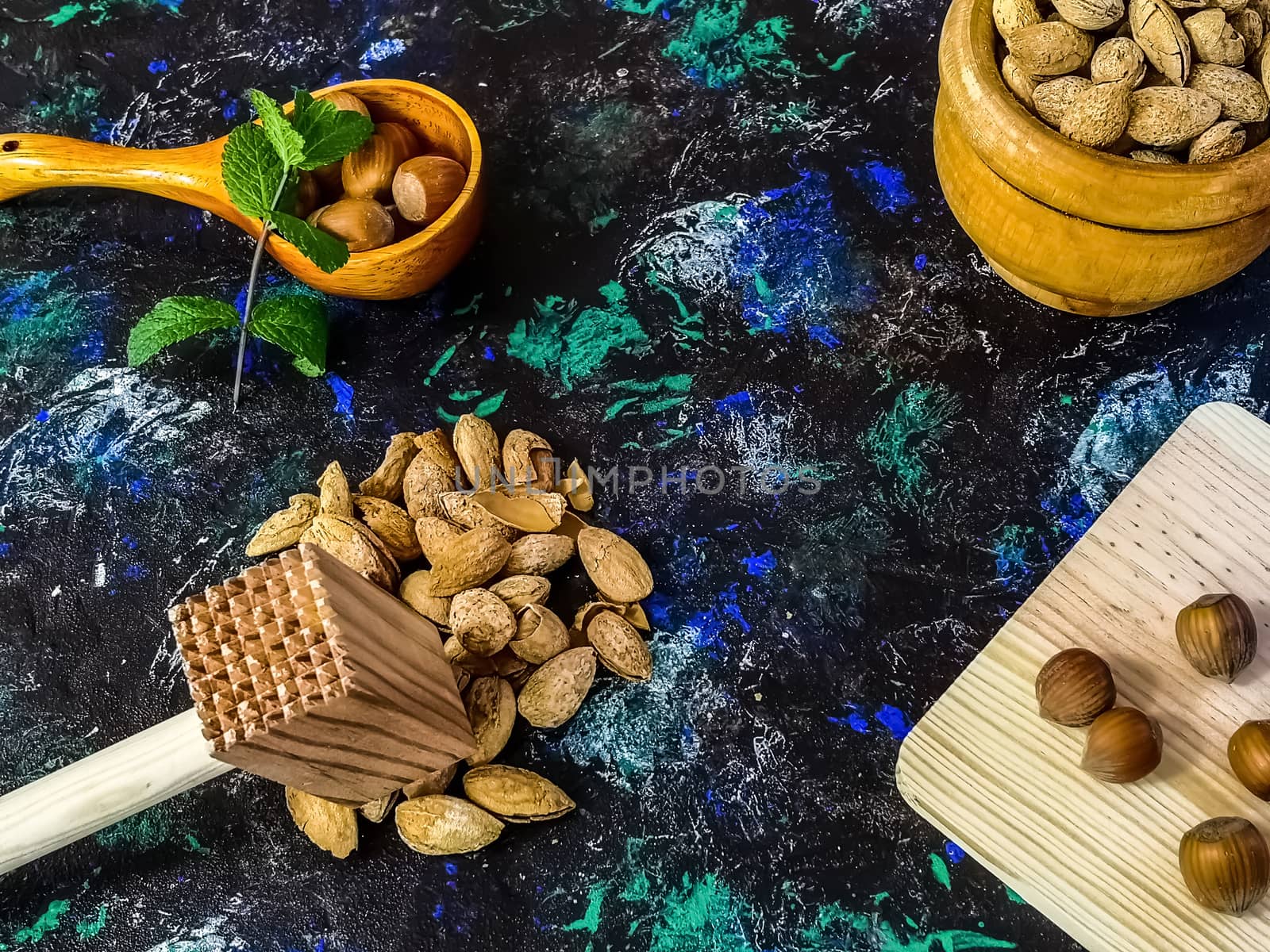 Walnuts and hazelnuts in composition on dark background by Barriolo82