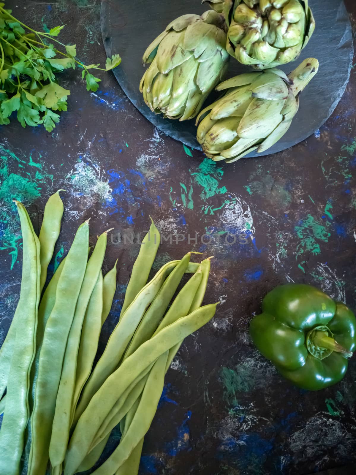 Orchard vegetables in composition on dark and rough background