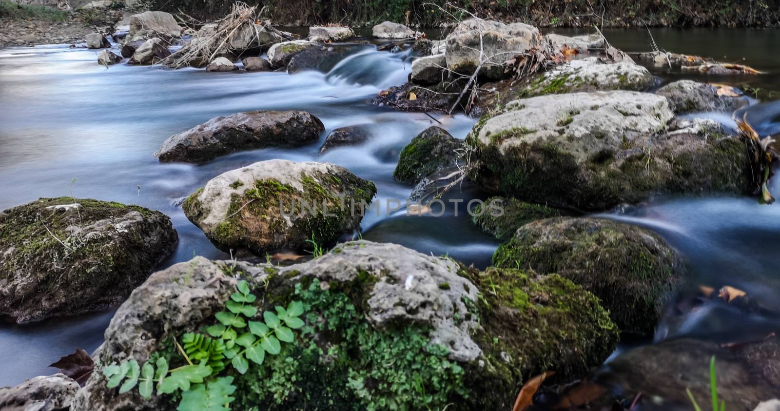 Palancia river water flowing through rocks in long exposure