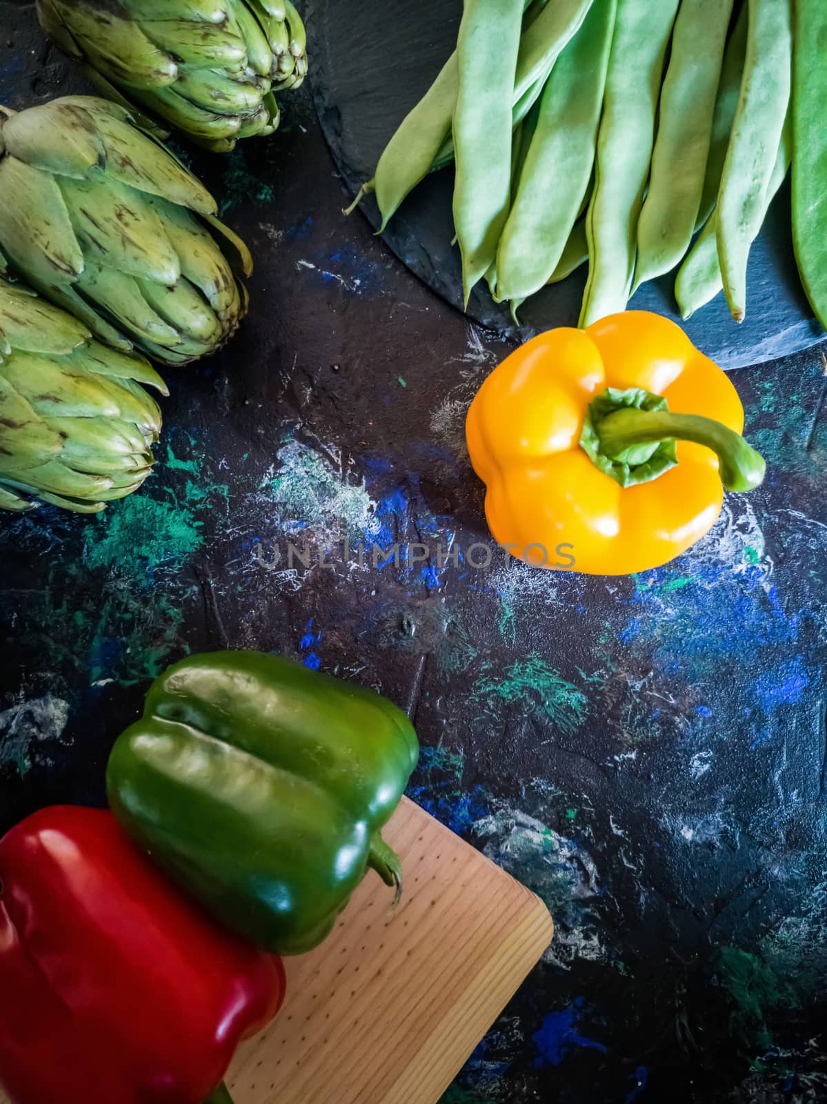Orchard vegetables in composition on dark and rough background