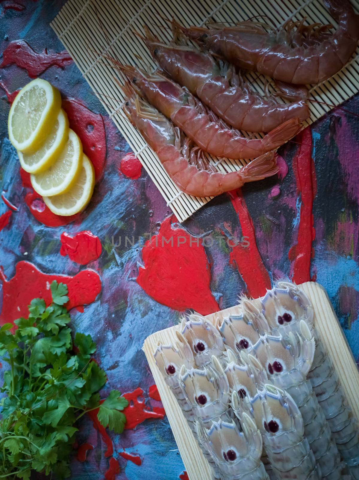 Seafood in composition on colorful and rough background