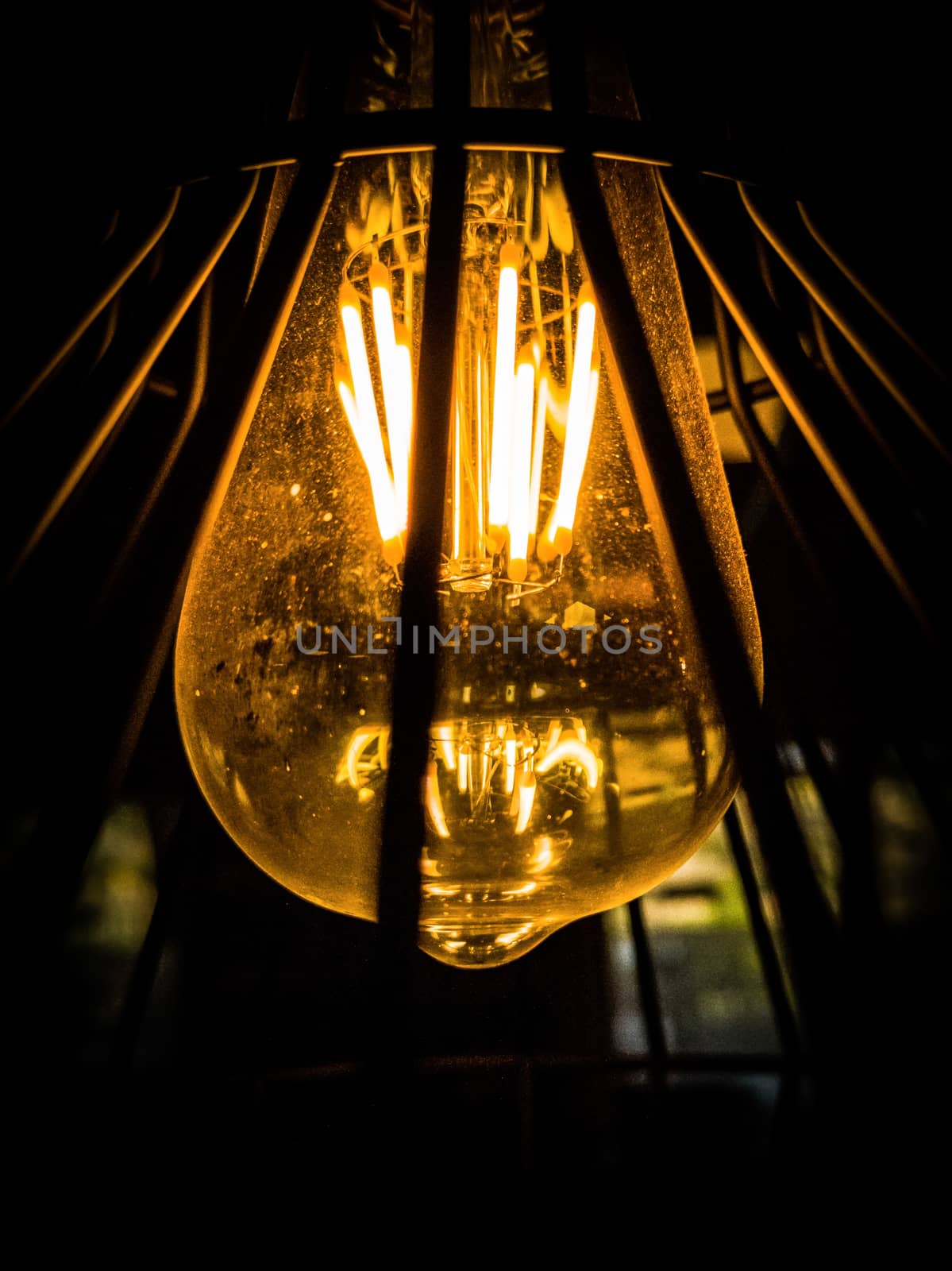 View from below of a bulb on a black background