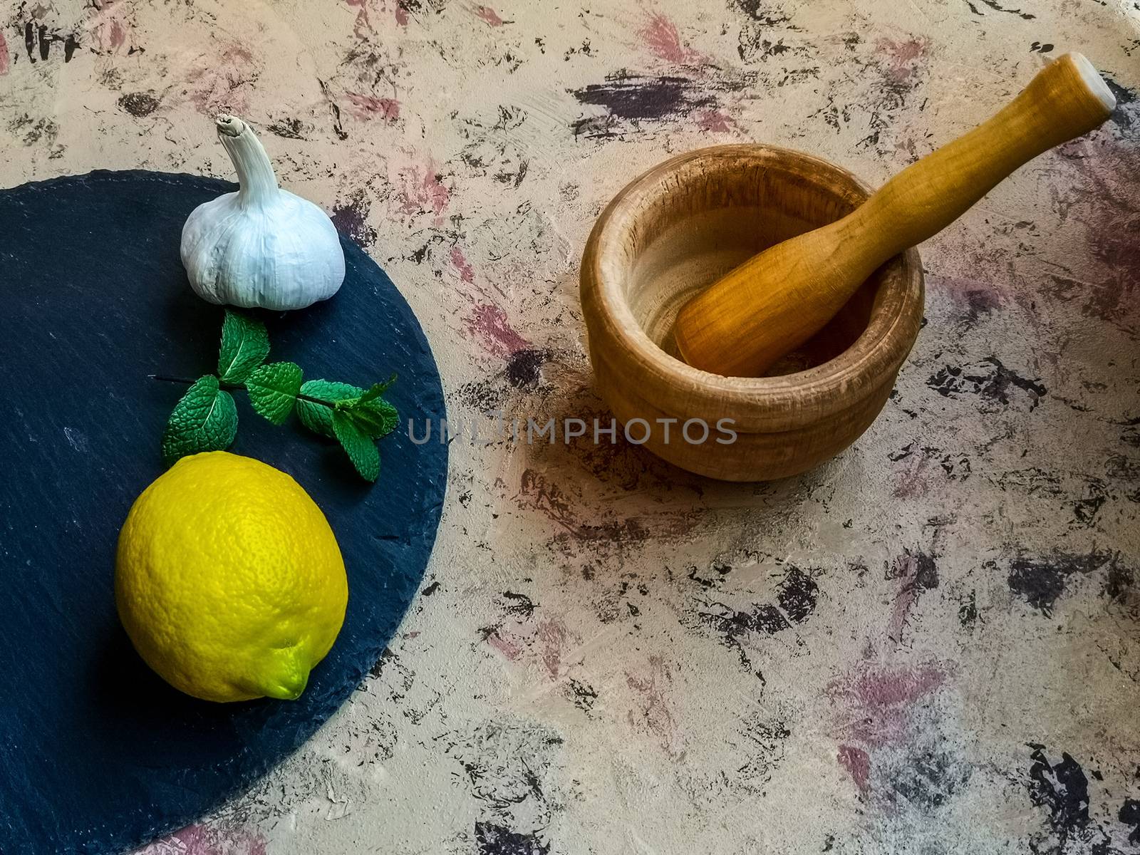 Ingredients and utensils to make mayonnaise with garlic in composition on light background