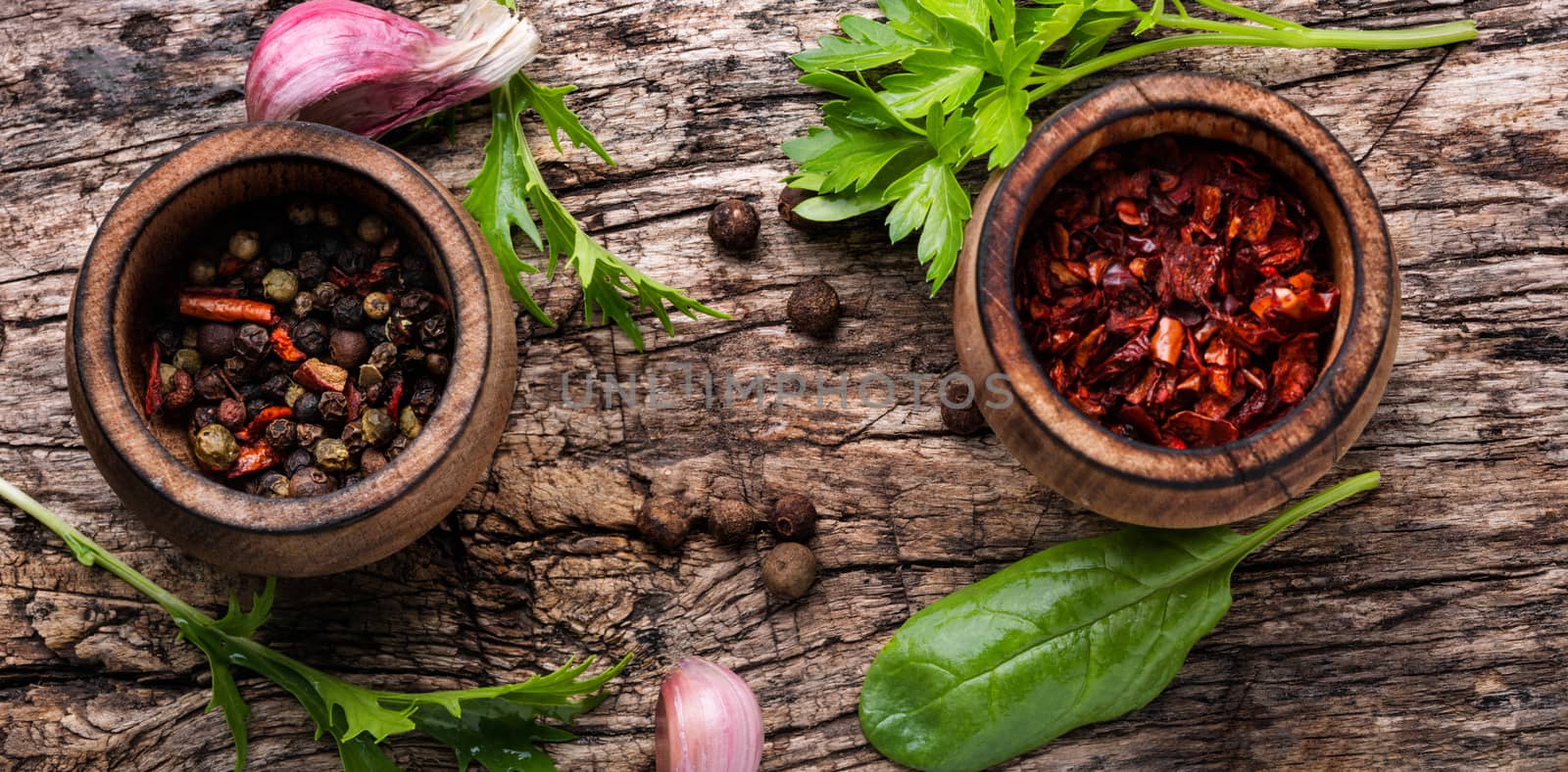 Herbs and spices on dark rustic kitchen table