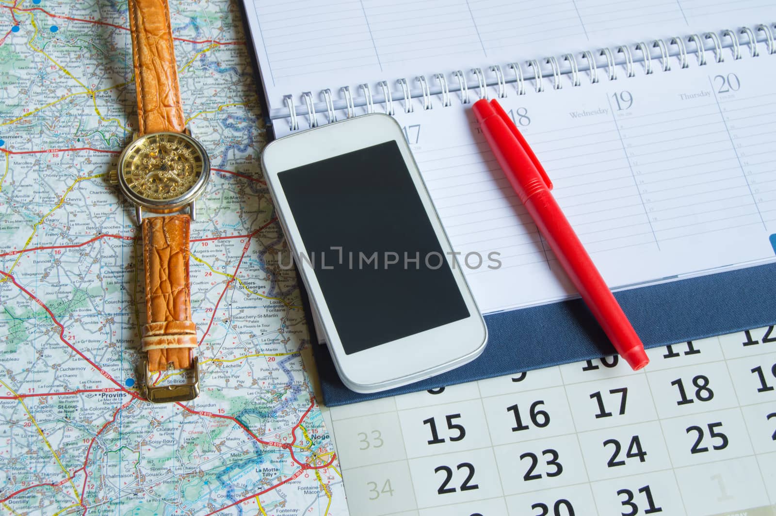 Diary and a calendar with hours, map, travel concept trip copy space by claire_lucia