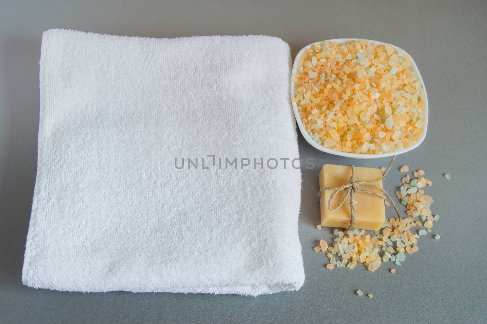 Handmade soap, a white towel, sea salt for body care by claire_lucia