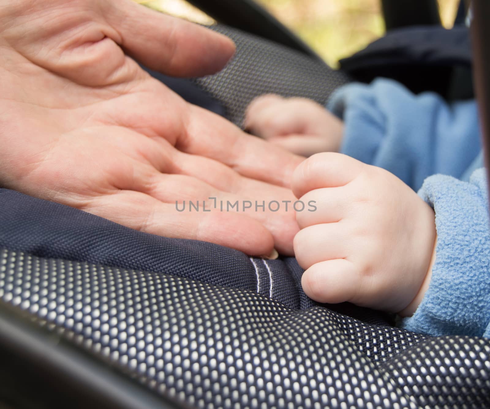 hand baby and elderly women grandmothers,selective focus.