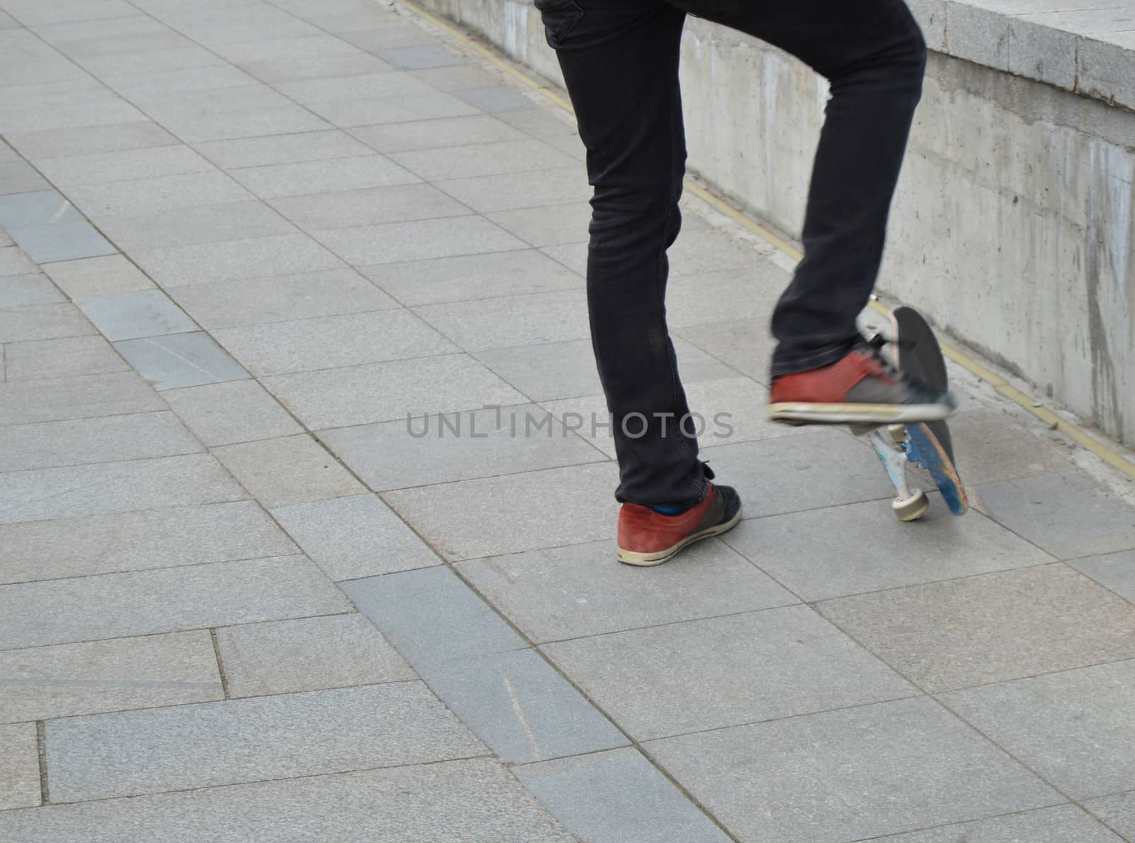 skateboard, a man riding and making stunts.