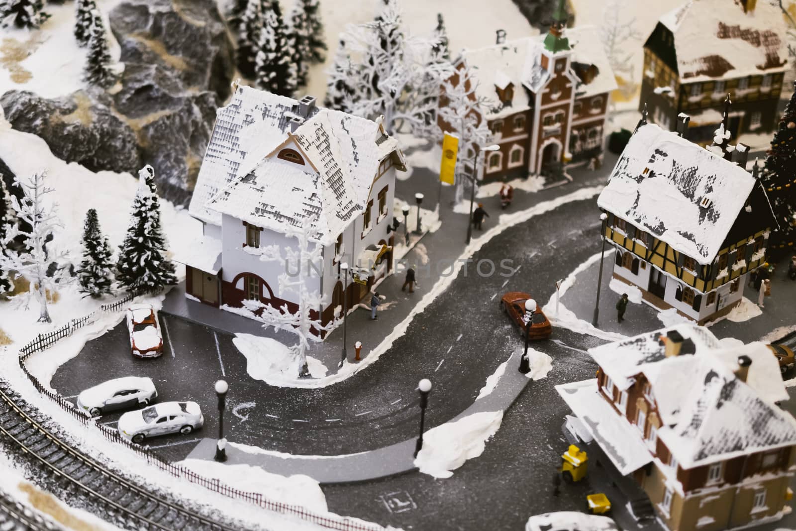 miniature city in winter - with houses, roads, cars, railway by alexandr_sorokin