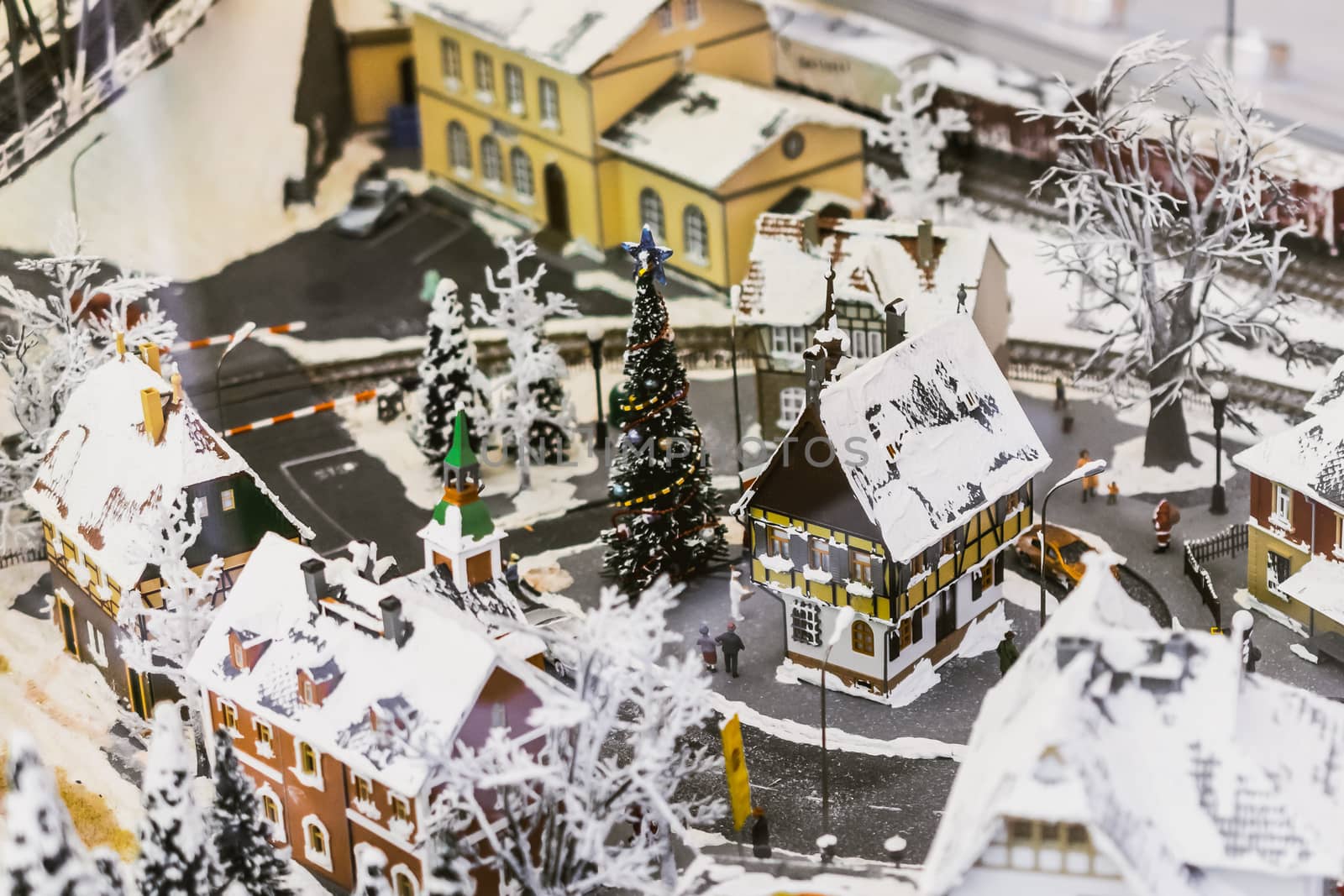 miniature city in winter - with houses, roads, cars, railway by alexandr_sorokin