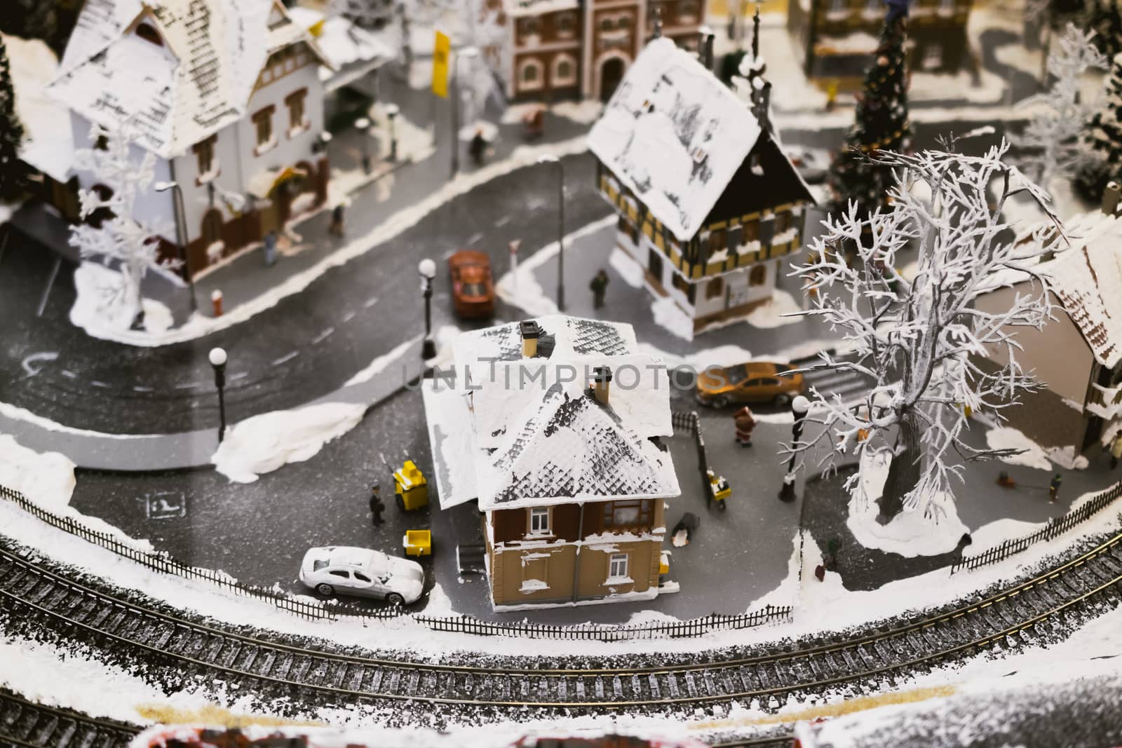 miniature city in winter - with houses, roads, cars, railway by alexandr_sorokin