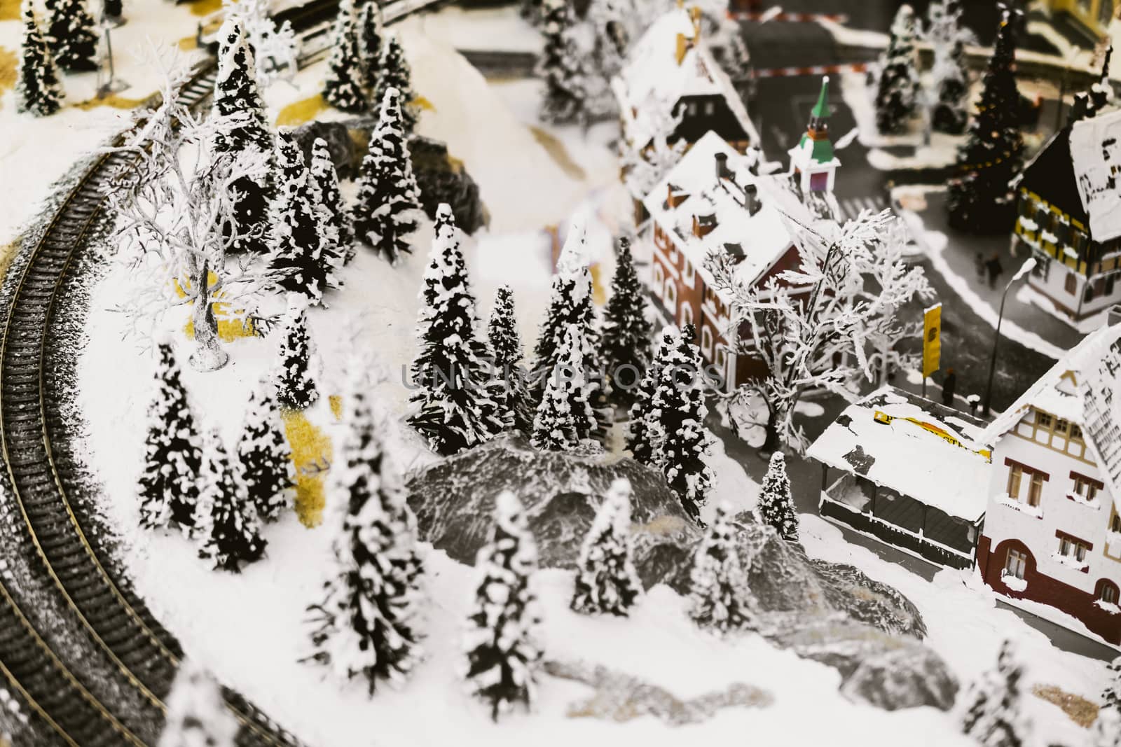 miniature city in winter - with houses, roads, cars, railway by alexandr_sorokin