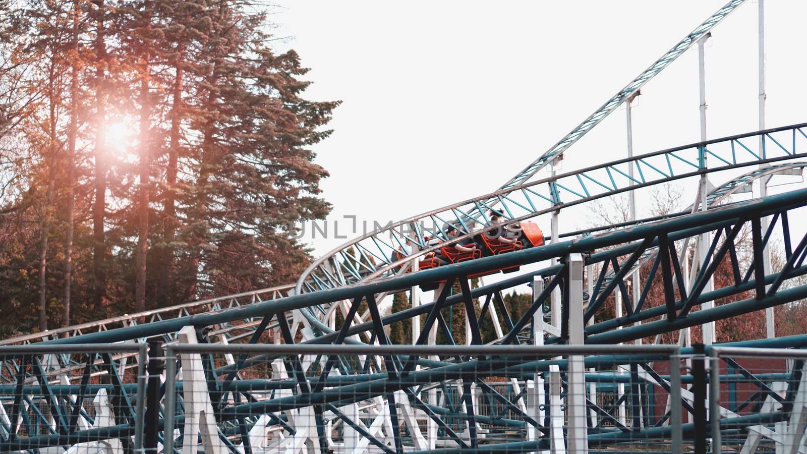 Colorful Looping Roller Coaster On A Beautiful Sunny Day by natali_brill