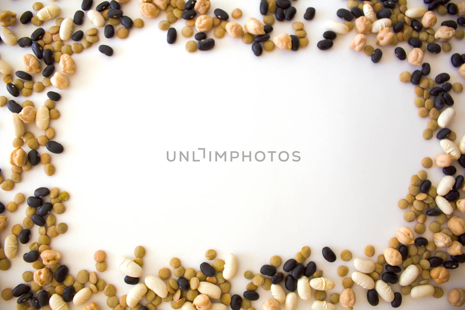 white beans, black beans, peas and lentils arranged in frame form