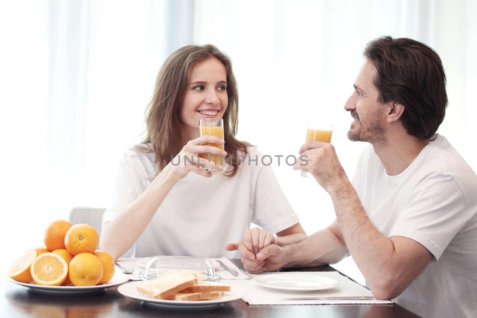 Couple having breakfast together at home 
