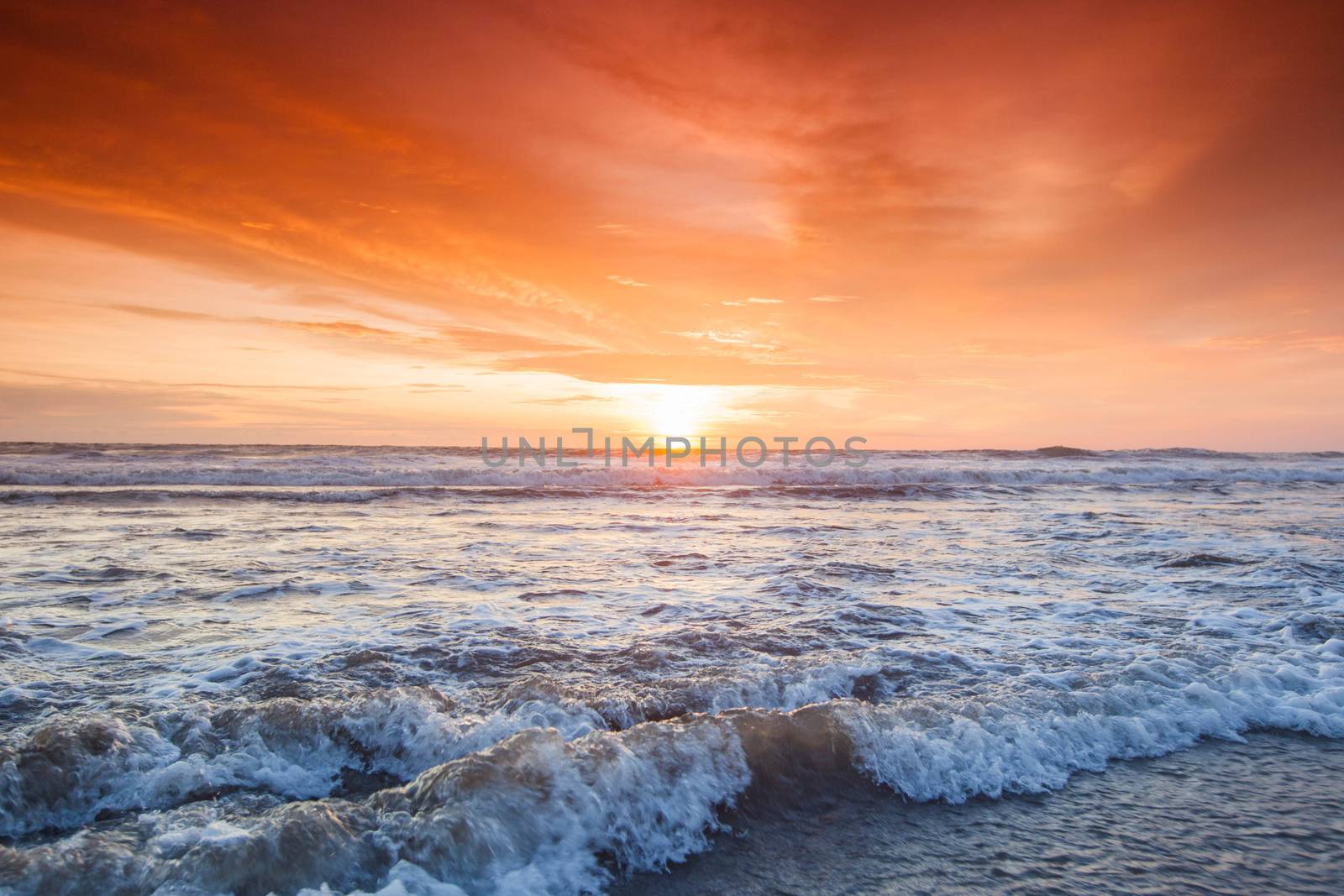 Amazing colorful sunset over sea form Bali beach