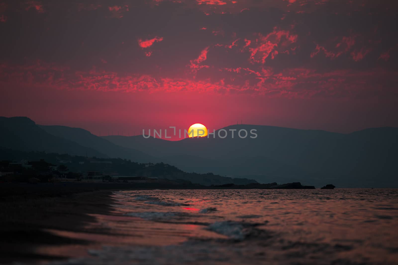 Sunrise on the greek beach with nice relections