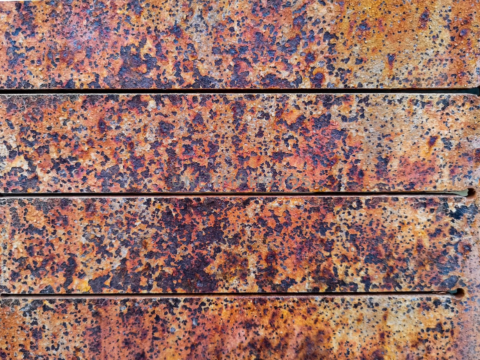 Rusty metal background with rough texture in brown tones