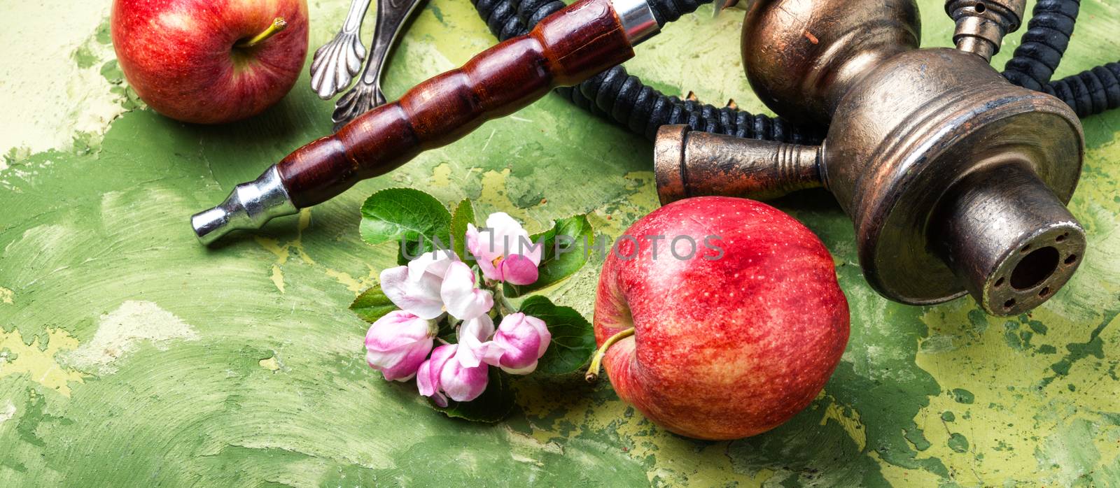 Modern fruit Hookah.Eastern shisha with apple. Hookah and apple.