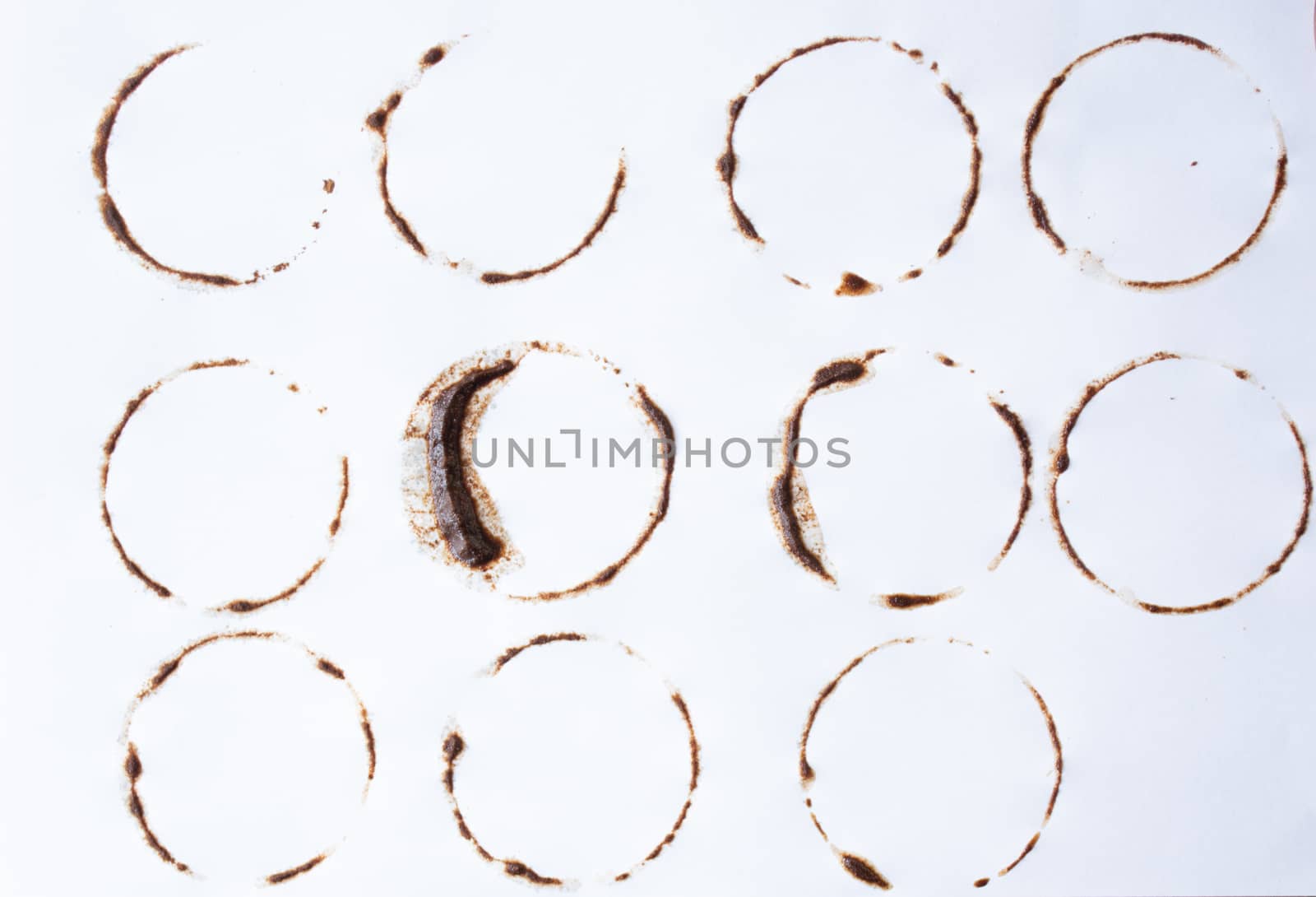 Coffee stains on white background. multiple shapes