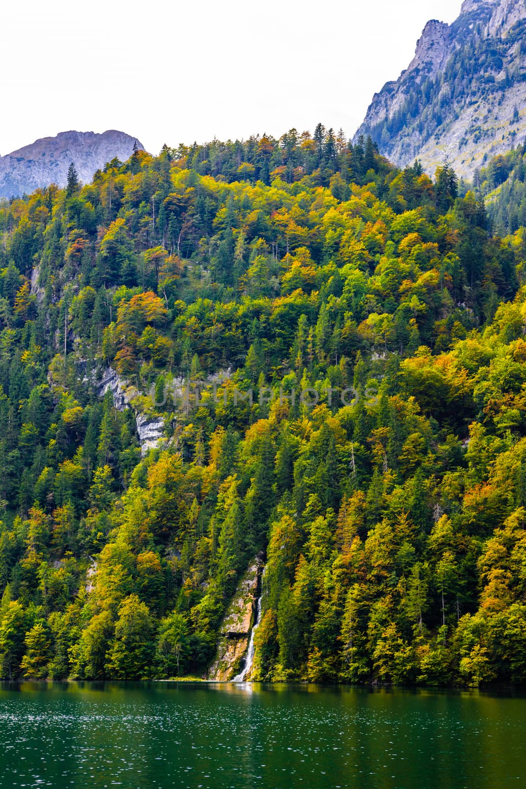 Small waterfall in Alp mountains near lake Koenigssee, Konigsee, Berchtesgaden National Park, Bavaria, Germany.