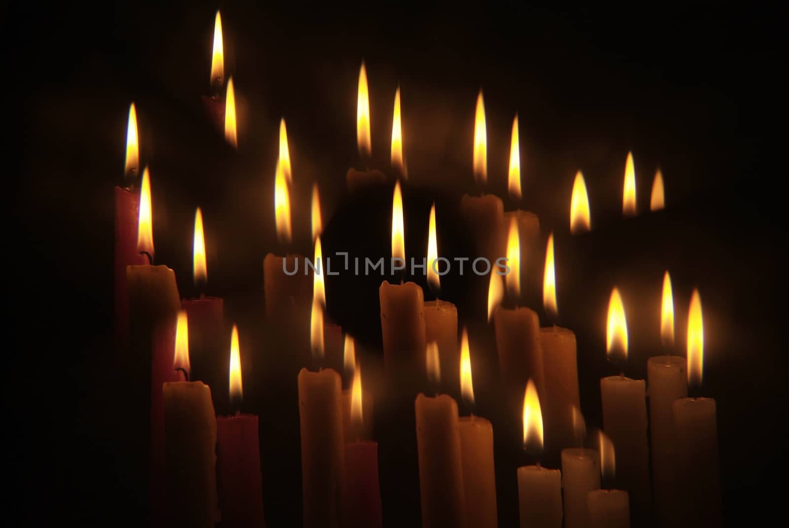 Candles flame close up on a black background