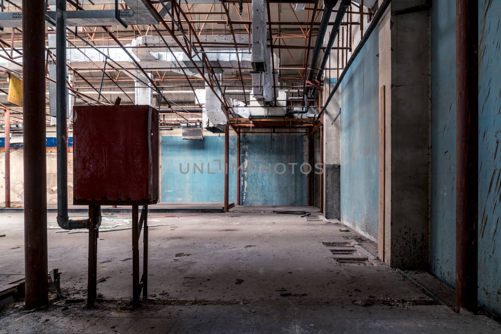 The abandoned industrial building. Fantasy interior scene. Shot in an abandoned ruin.