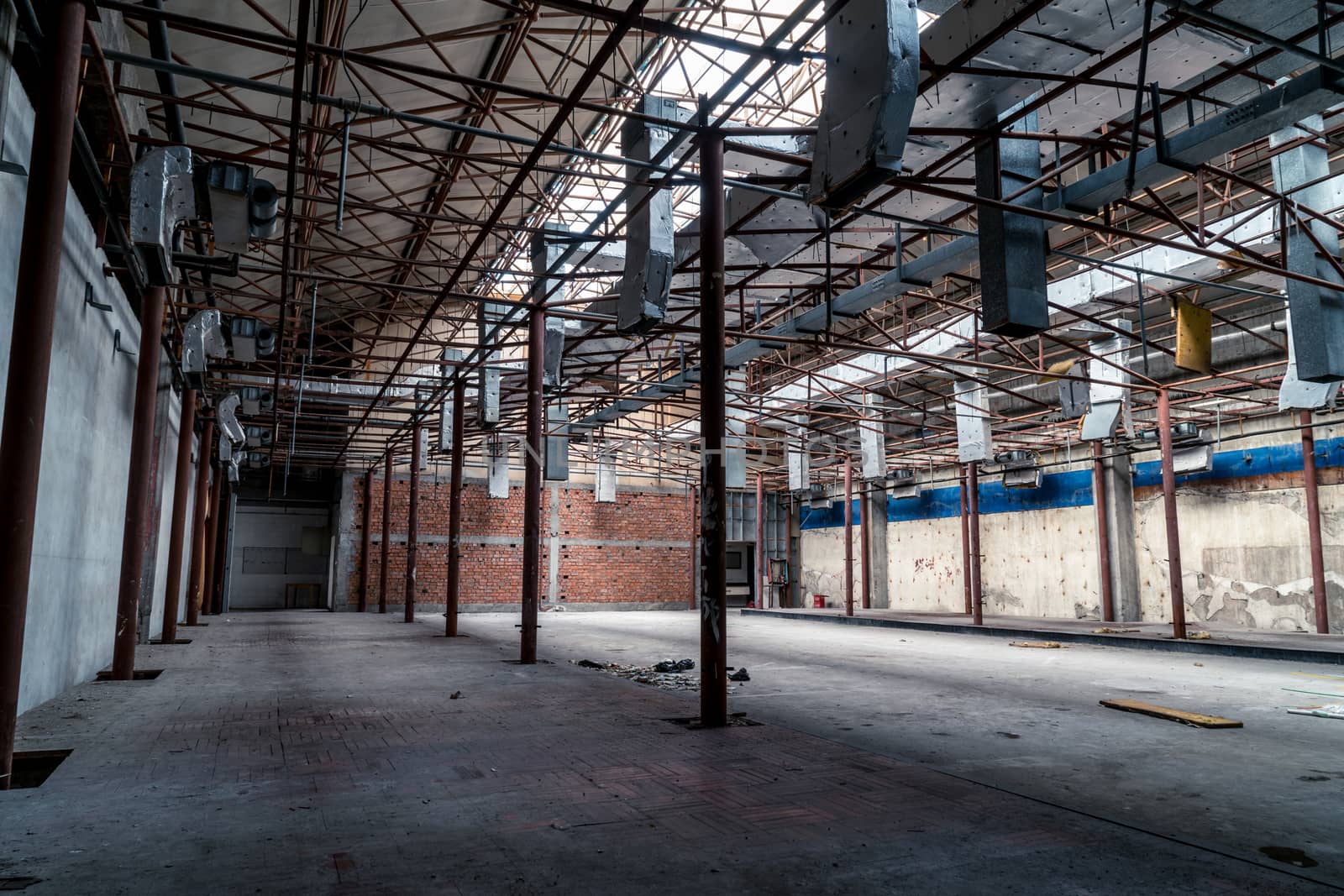 The abandoned industrial building. Fantasy interior scene. Shot in an abandoned ruin.