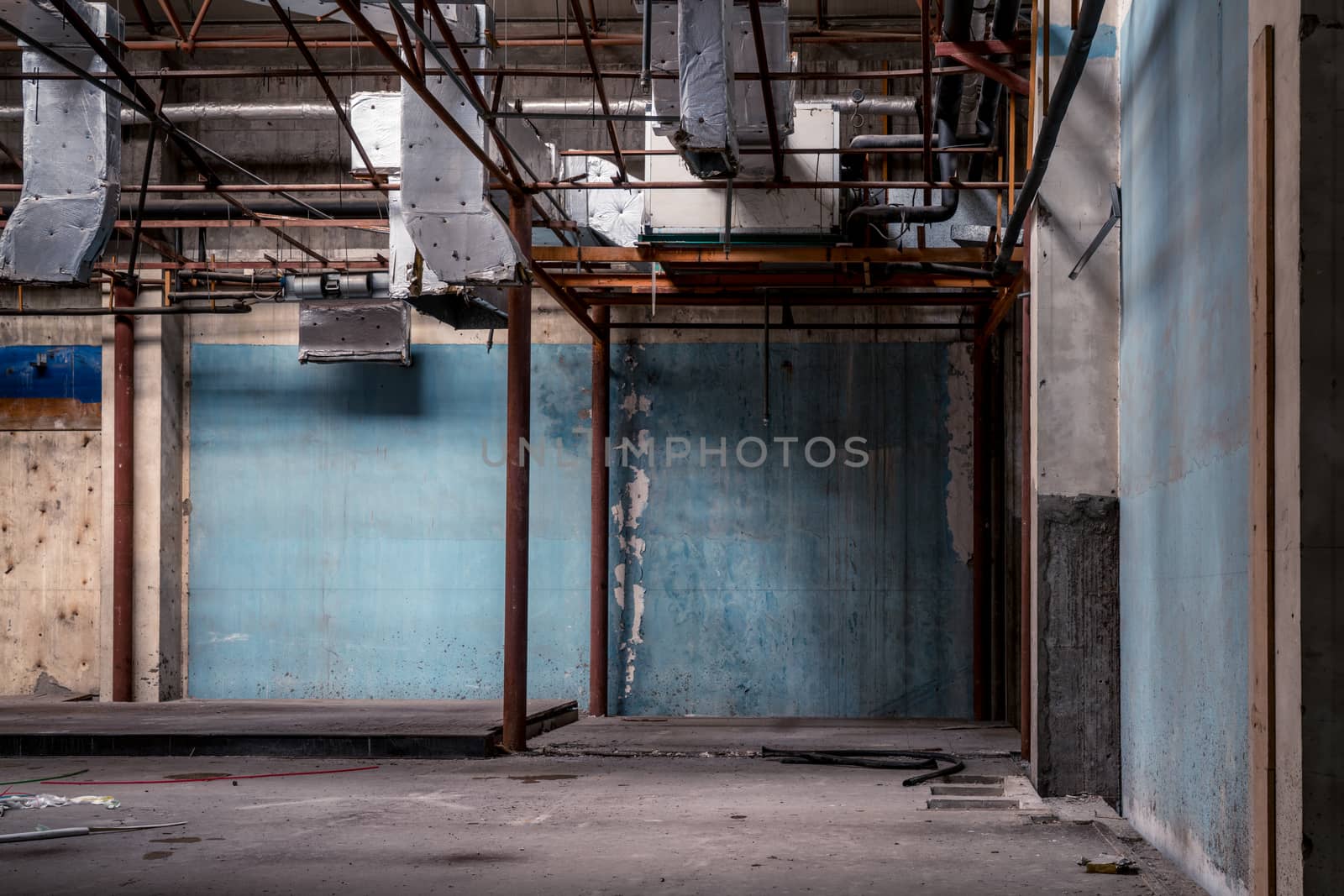 The abandoned industrial building. Fantasy interior scene. Shot in an abandoned ruin.