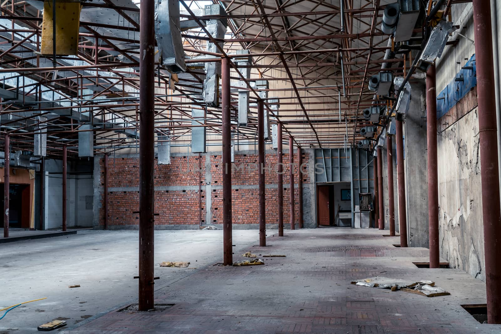 The abandoned industrial building. Fantasy interior scene. Shot in an abandoned ruin.