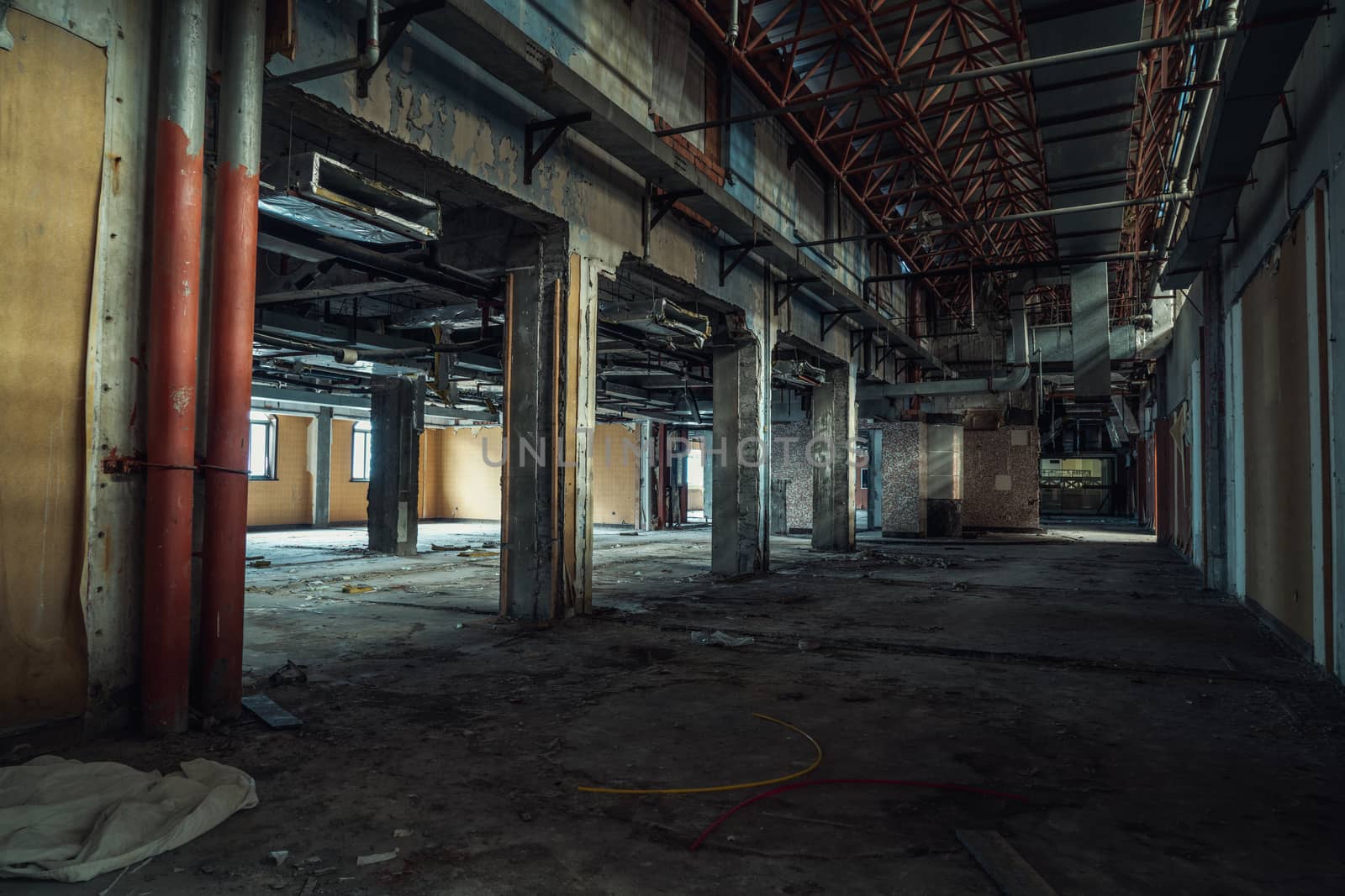 The abandoned industrial building. Fantasy interior scene. Shot in an abandoned ruin.