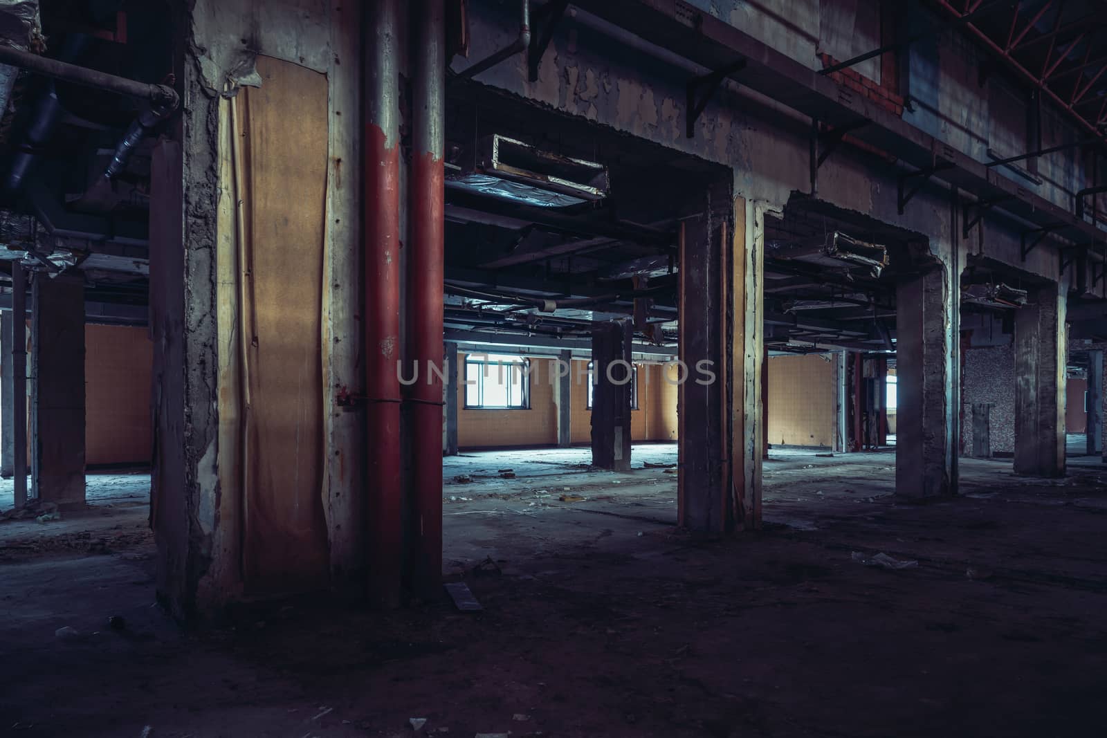 The abandoned industrial building. Fantasy interior scene. Shot in an abandoned ruin.