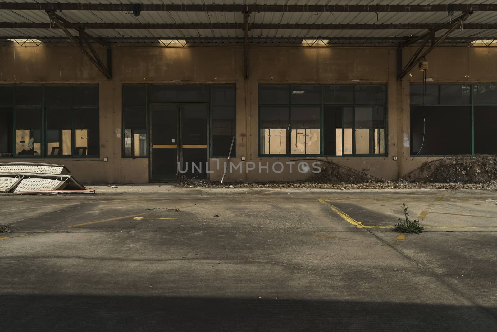 The abandoned industrial building. Fantasy interior scene. Shot in an abandoned ruin.