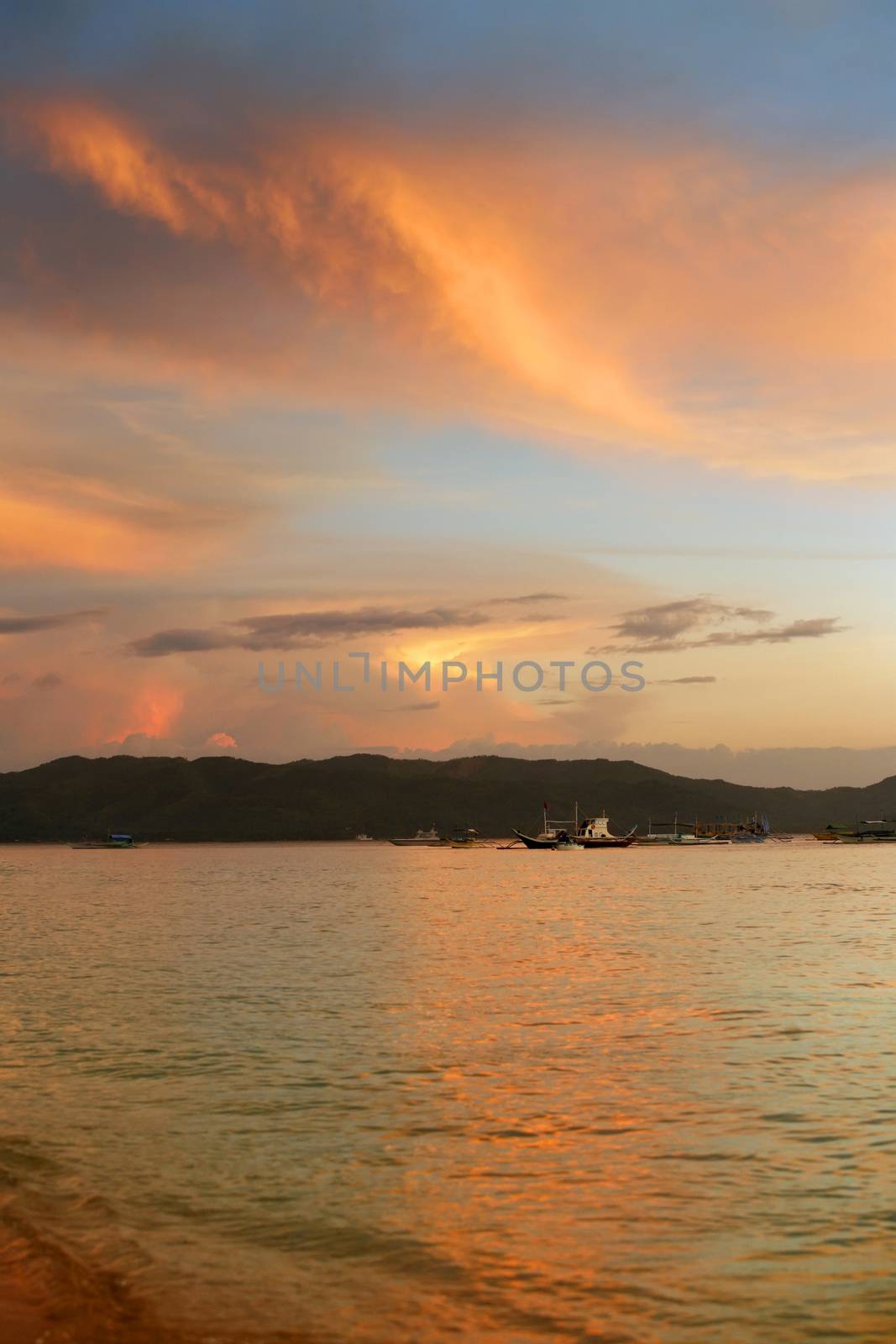 Fishing boats in the ocean at sunset. Boracay. Philippines