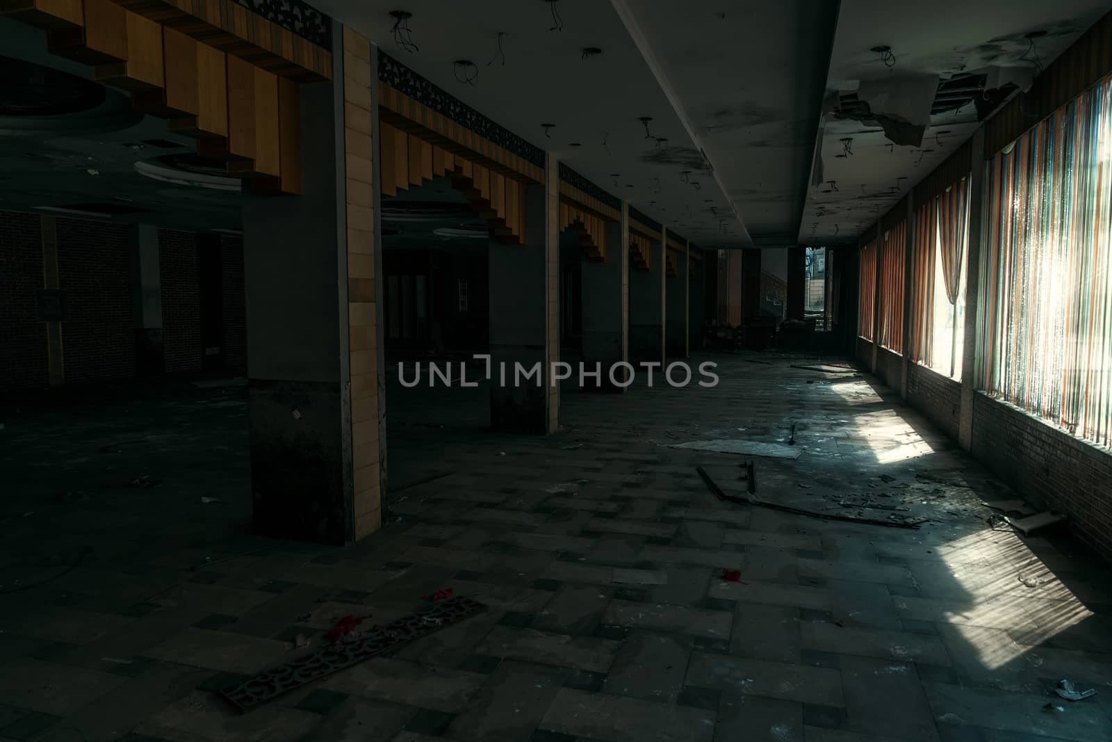 The abandoned industrial building. Fantasy interior scene. Shot in an abandoned ruin.