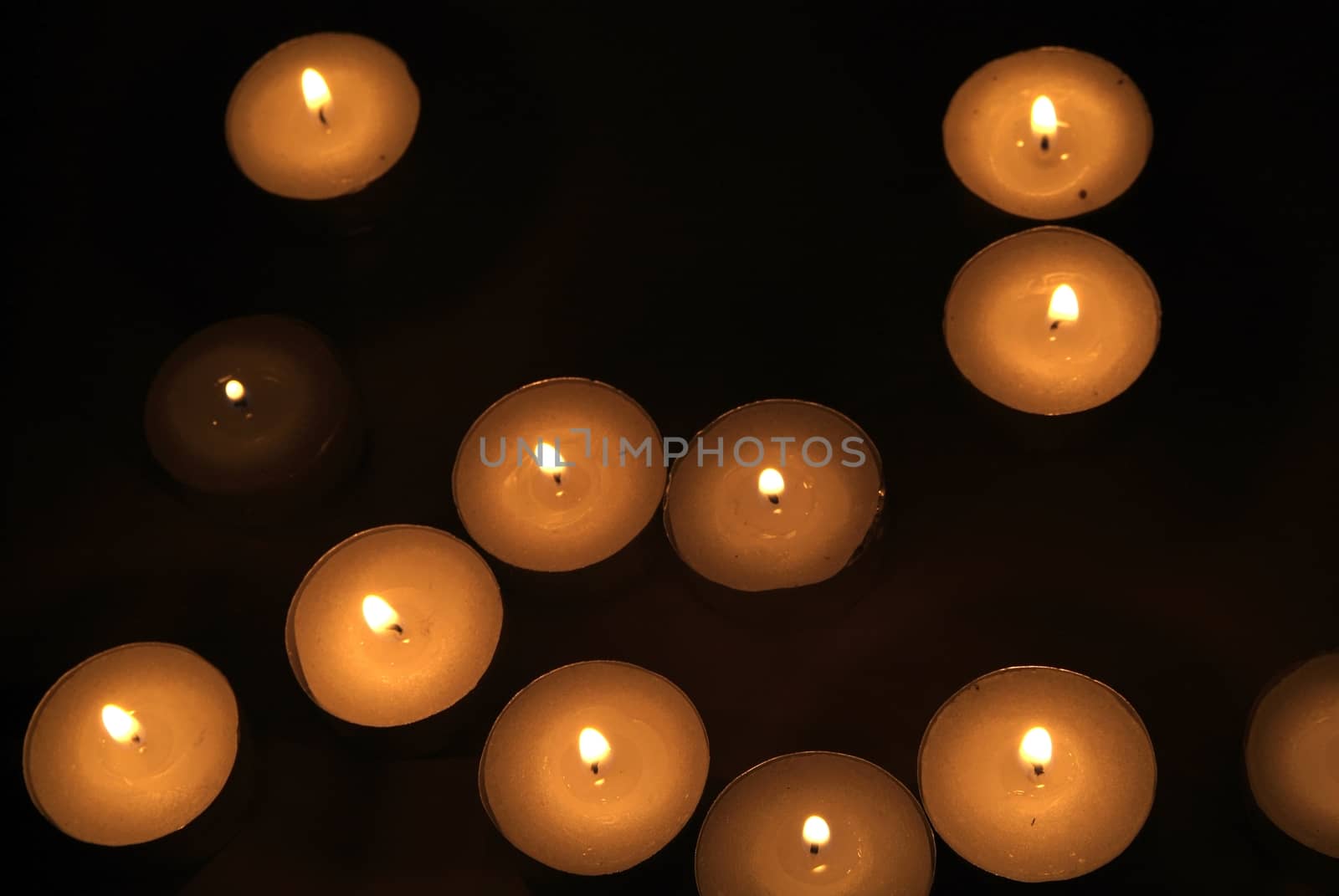 Candles flame close up on a black background