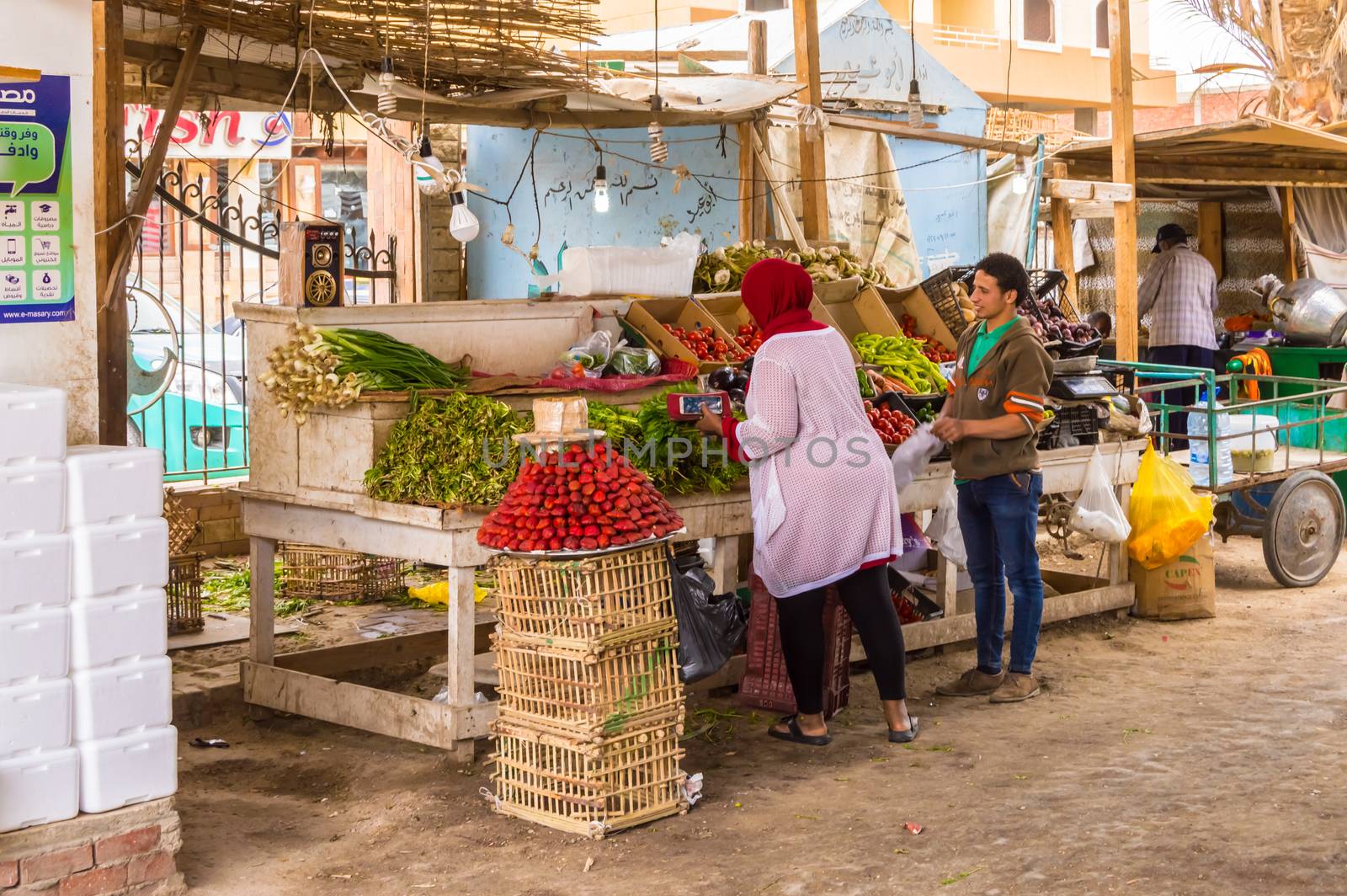 EGYPT, HURGHADA - 04 Avril 2019:Seller of fruits and vegetables in the old marina of the city of Hurghada along the Red Sea in Egypt