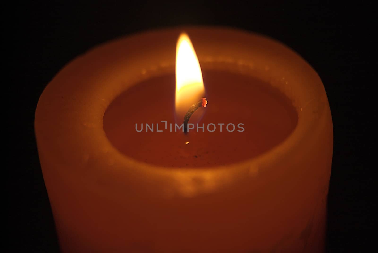 Candles flame close up on a black background