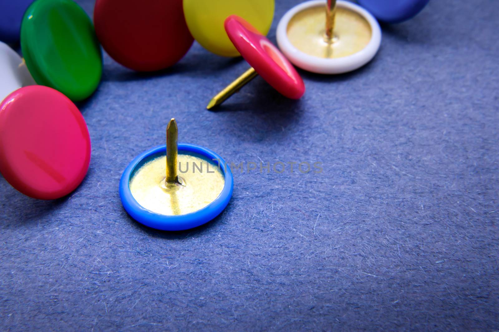Groups of Colorful Thumb Tacks on the Table by seika_chujo