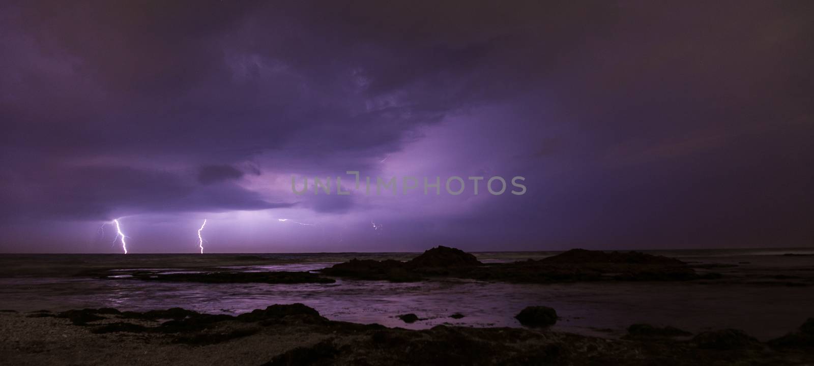 Thunderstorm on mediterranean sea beach by javax