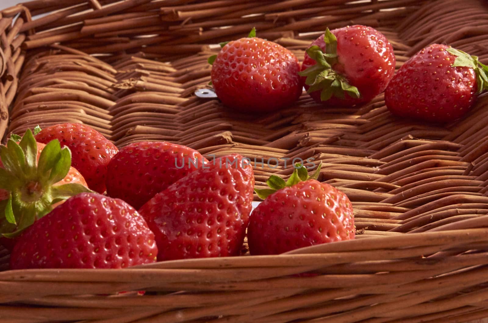 Strawberries in a cane basket, long exposure with natural light