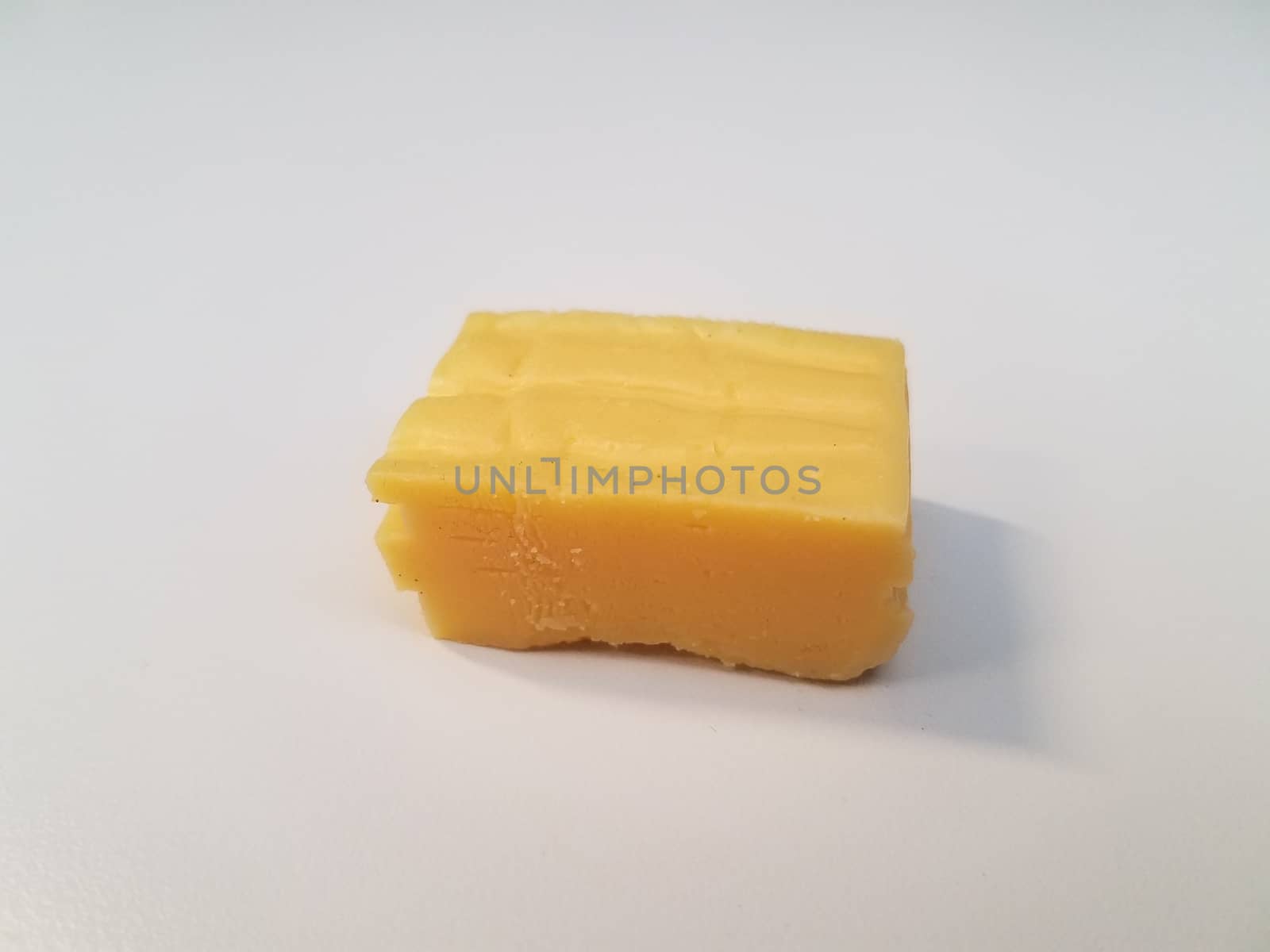 stack of sliced yellow cheese on white surface or table