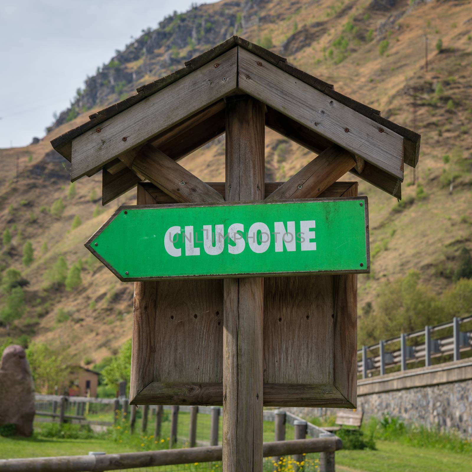 Road sign for pedestrians and bicycles indicating the direction for "Clusone" beautiful city near Bergamo.