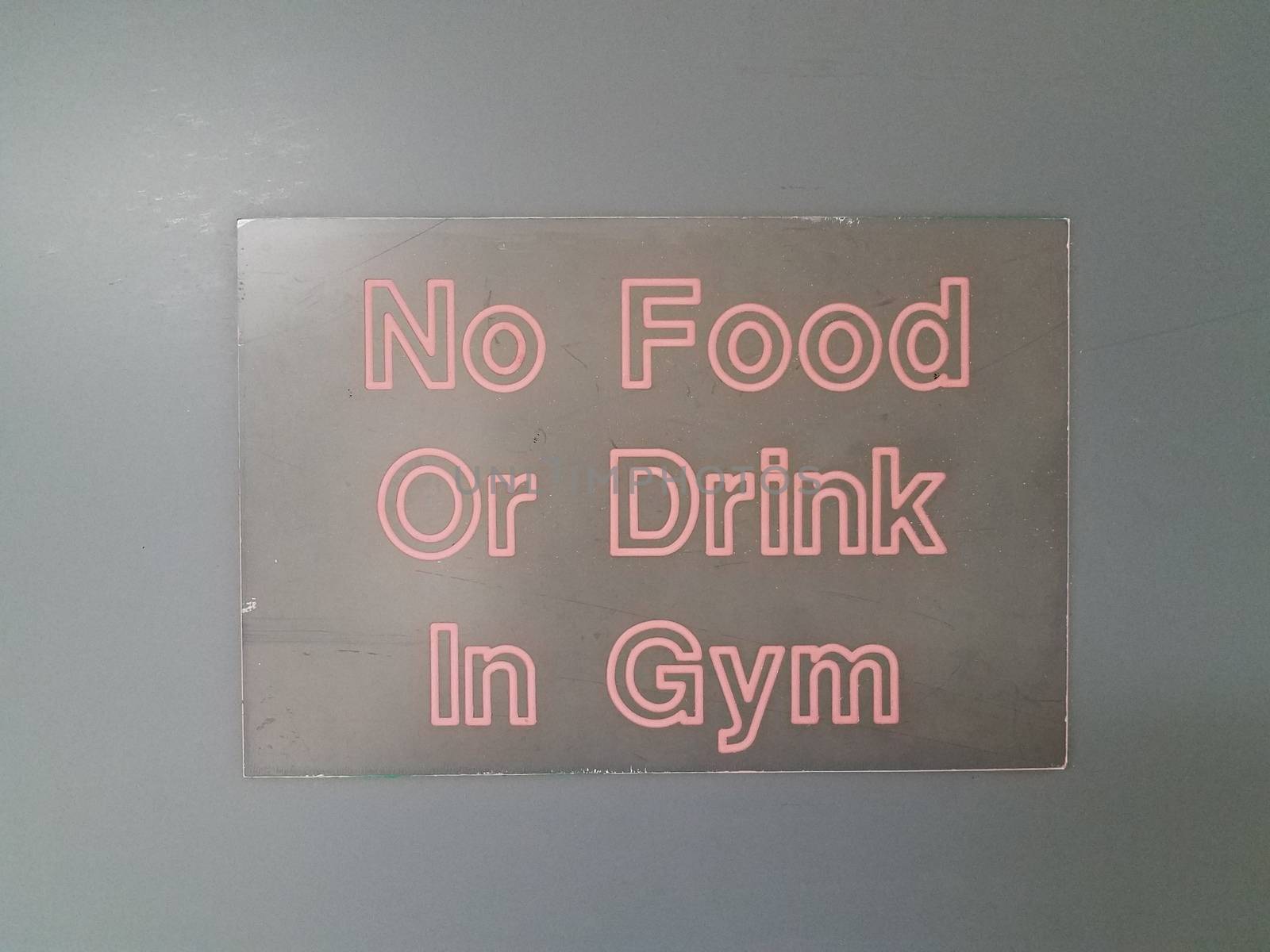 black no food or drink in the gym with red text on wall by stockphotofan1