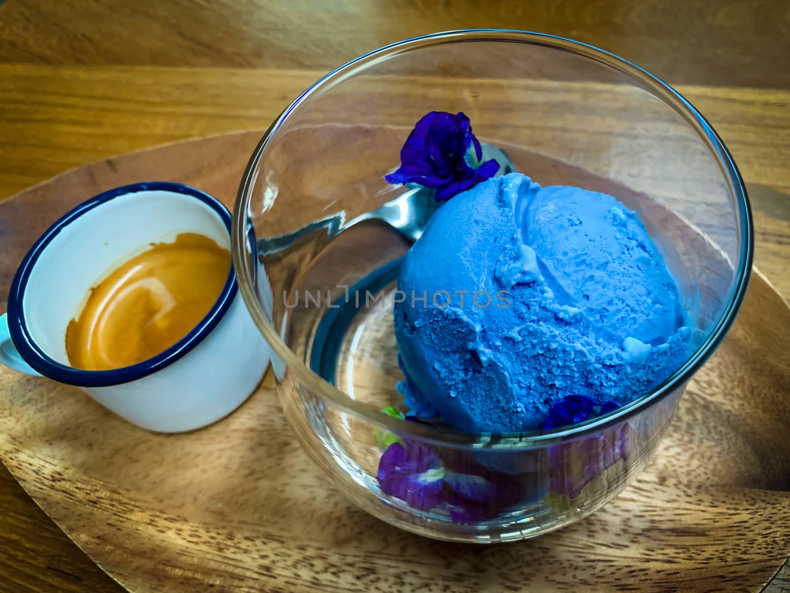 Blue ice cream in a clear glass with ready-to-eat coffee