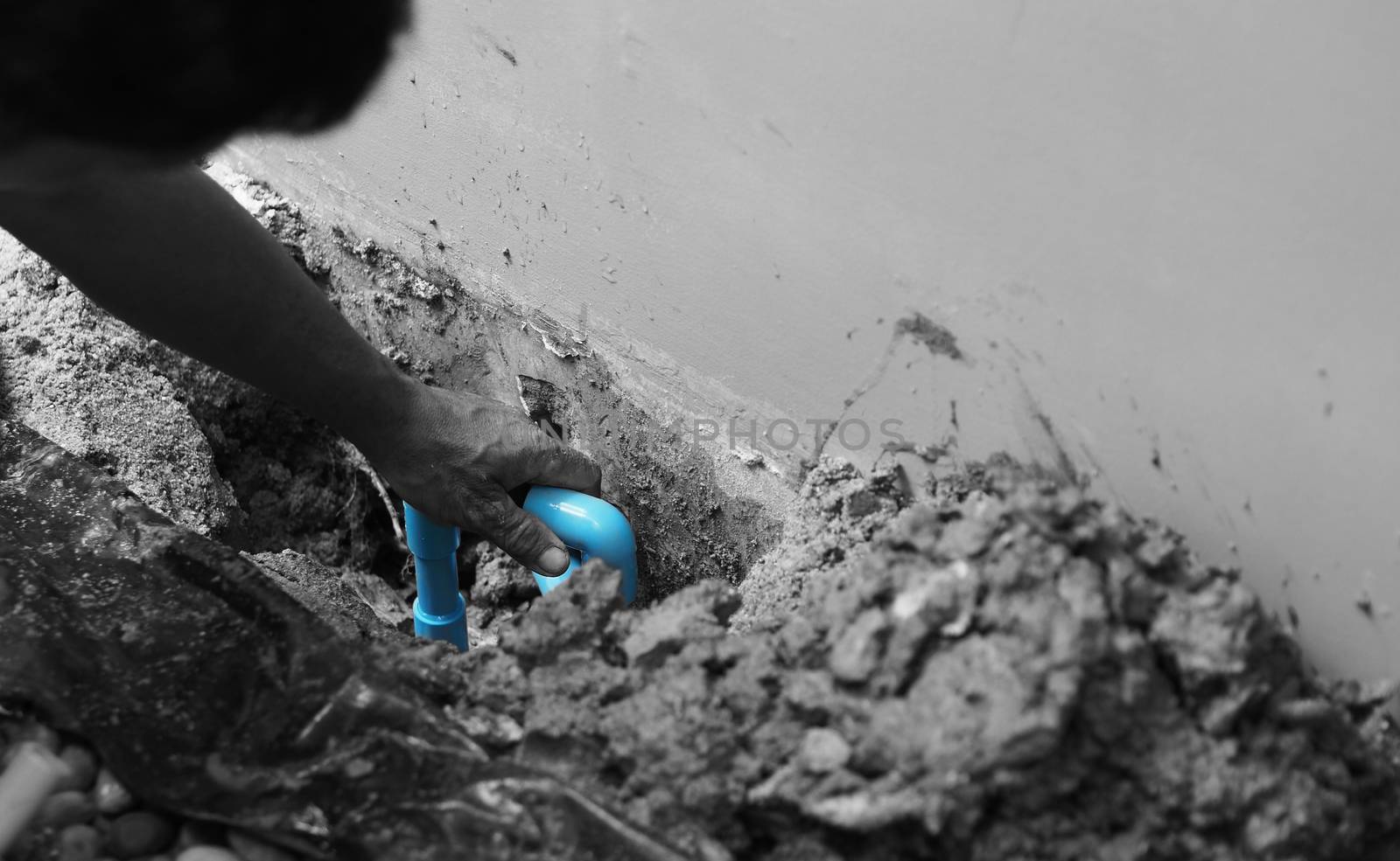 Fixing leaking water pipe underground the house  by gnepphoto