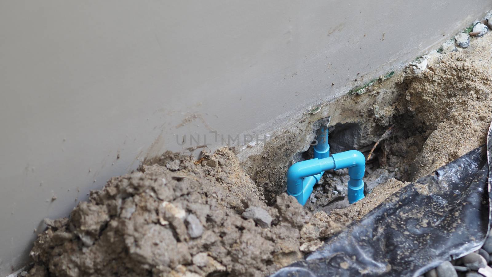 Fixing leaking water pipe underground the house  by gnepphoto