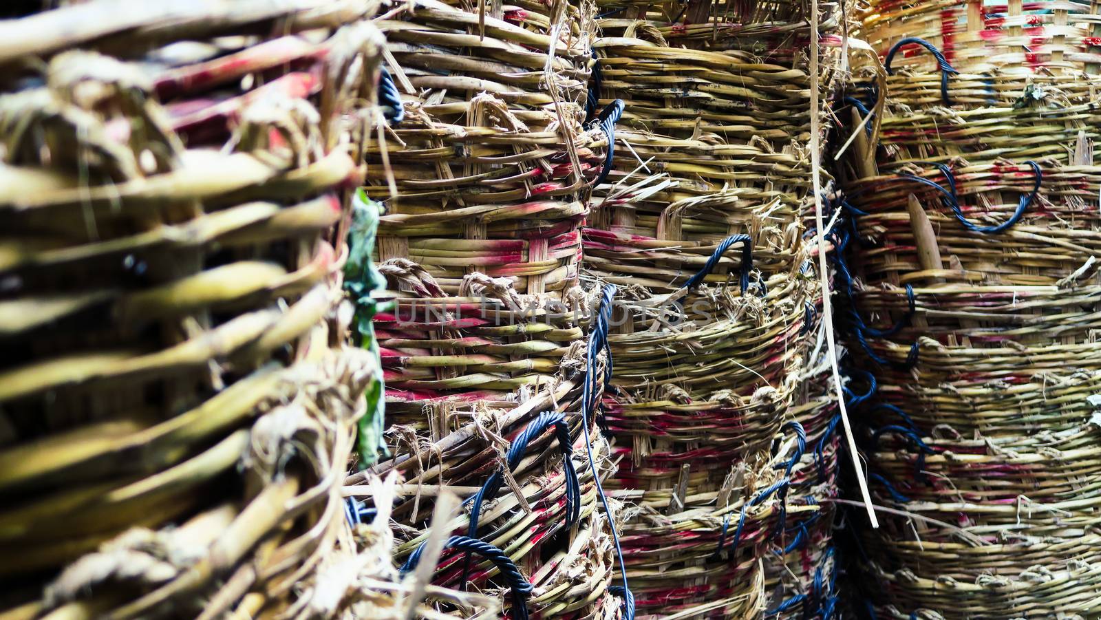 Stack of big wicker baskets in market