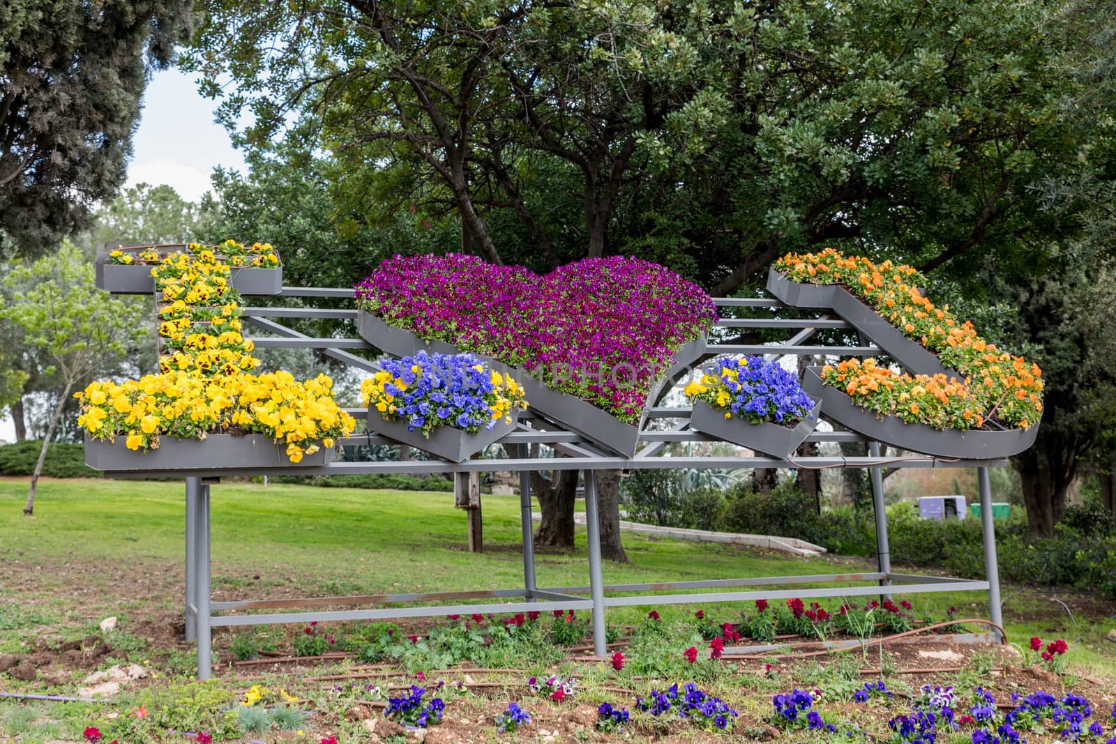 flower compositon in a park in jeruselem with the text I love jerusalem